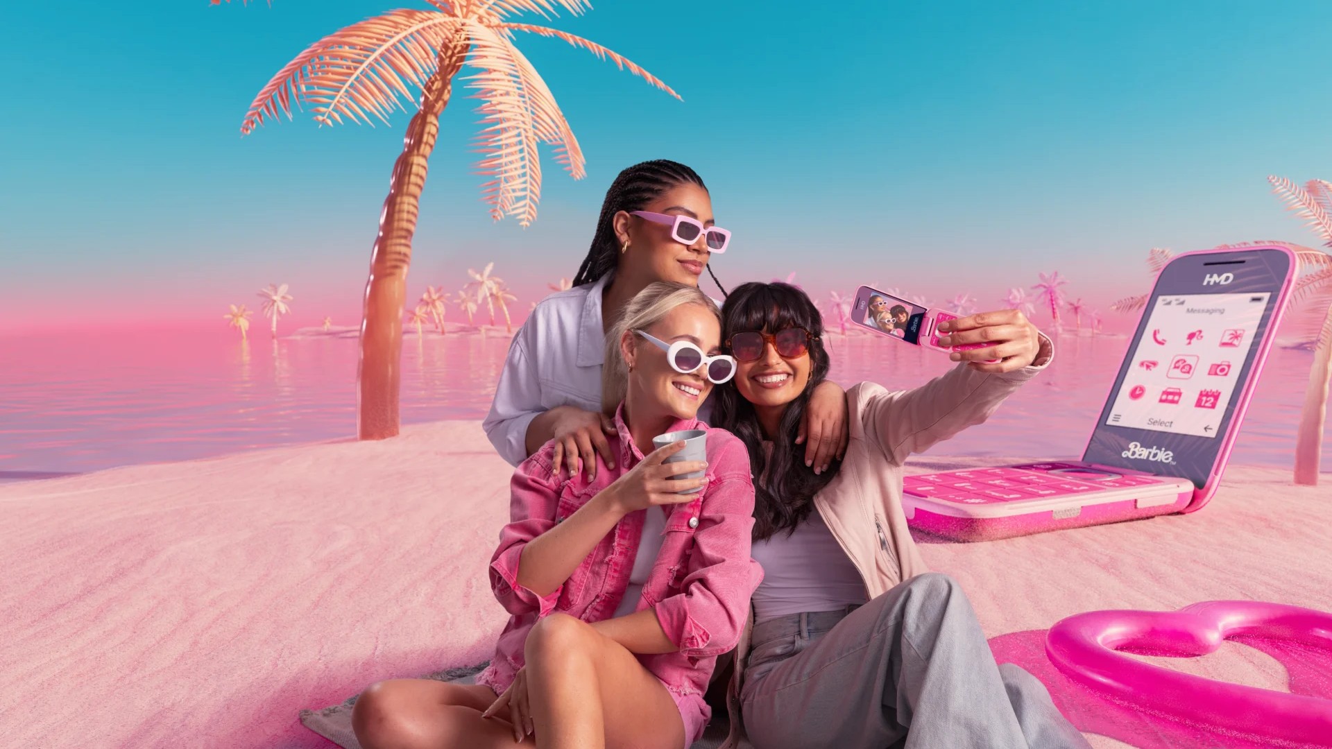 Girls on beach with Barbie Phone